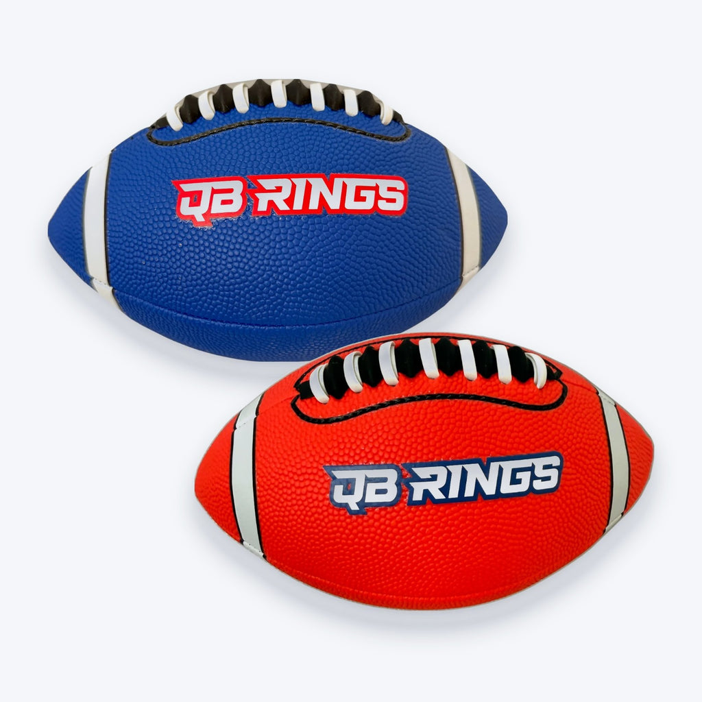 Blue and red QB Rings footballs, laces up with the QB Rings logo