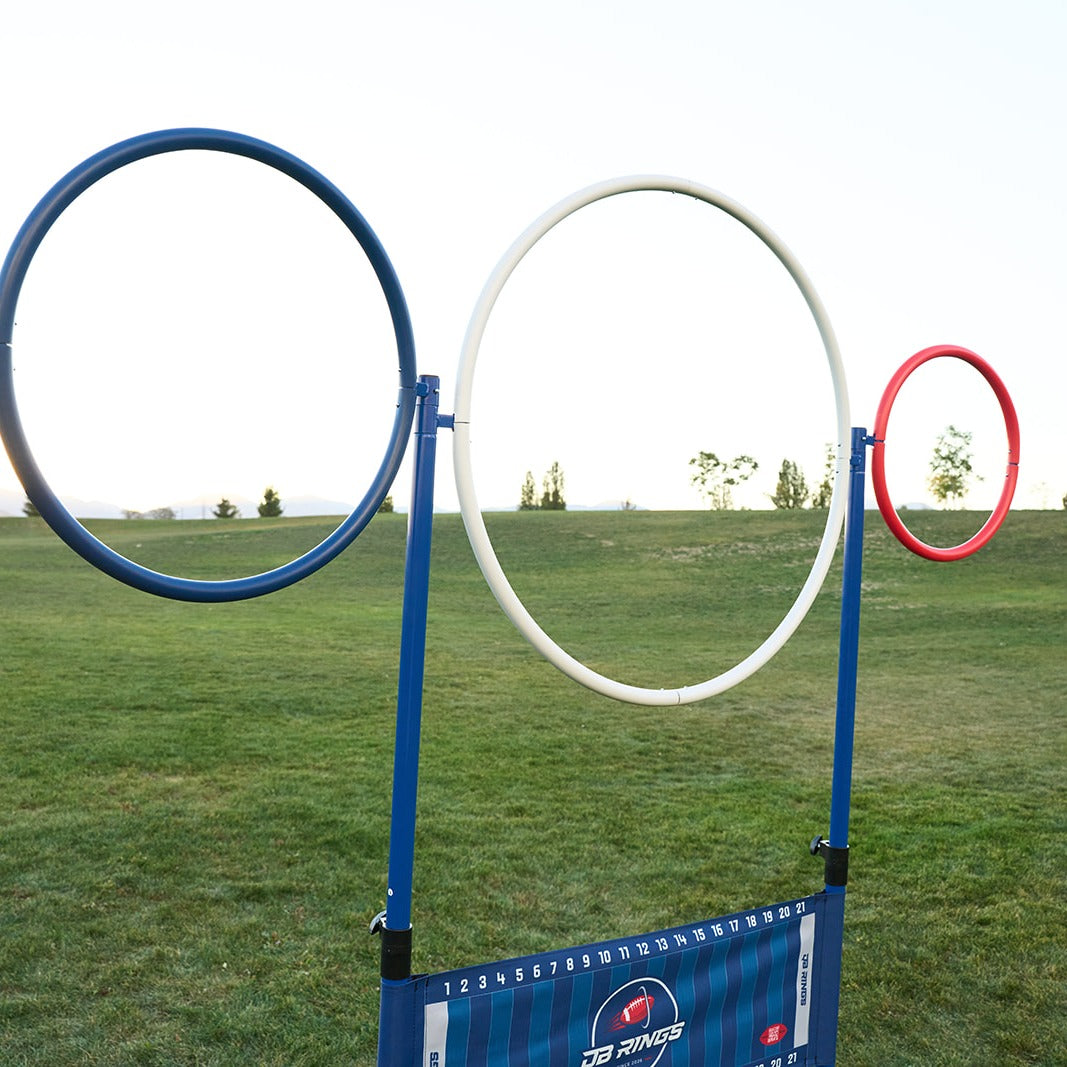 Low-angle view of the blue, white and red QB Rings rings against the sky